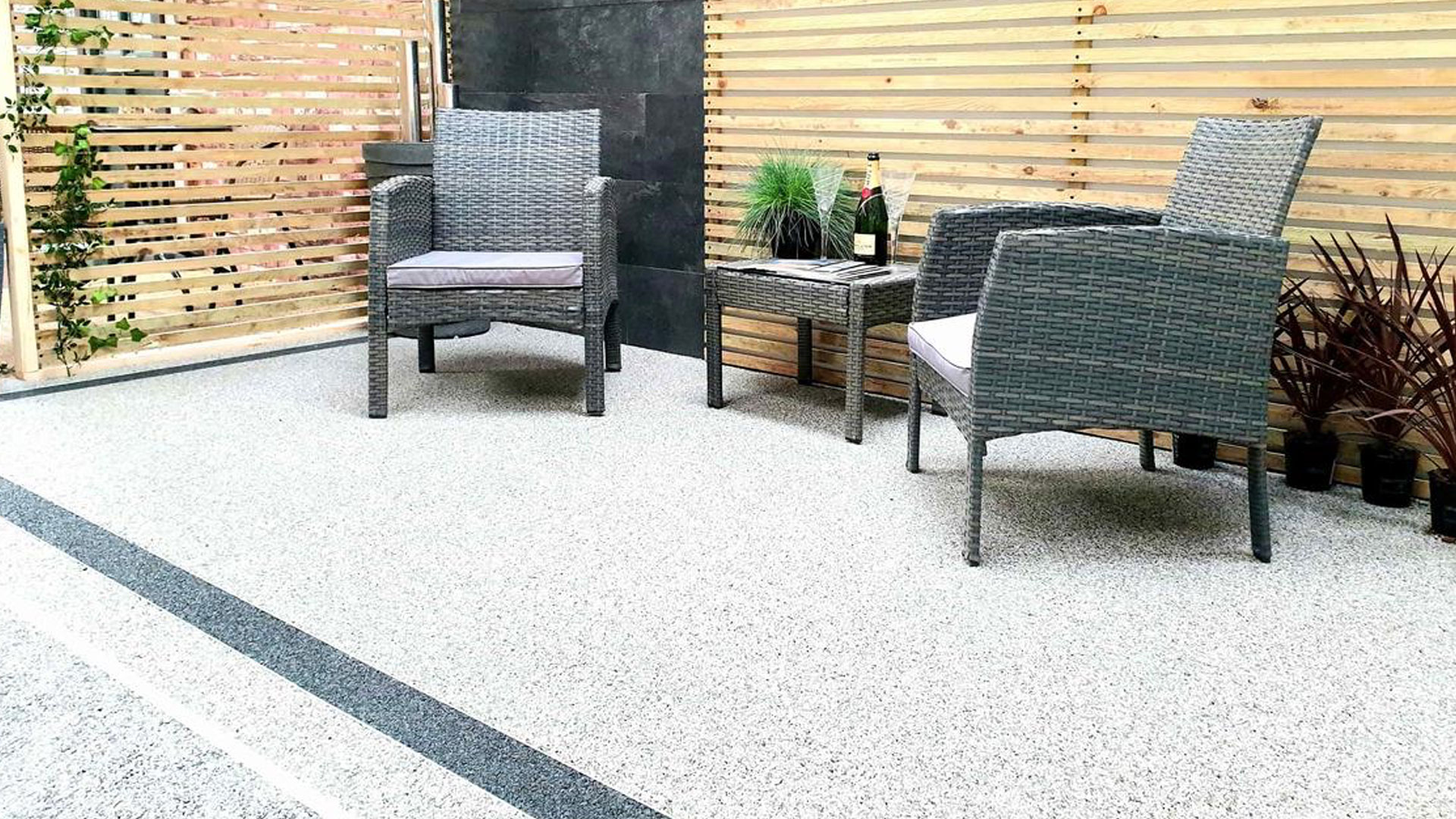 Modern resin bound driveway with decorative stone finish